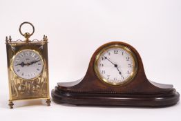 A brass cased Koma 400 day clock with glass sides,