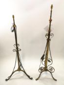 A 19th century brass telescopic standard lamp on three flared and scroll feet,