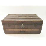 A 19th century composition and wood bound trunk,