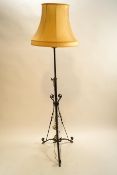 A wrought metal standard lamp, circa 1900,