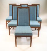 A set of twelve teak framed dining chairs, with blue upholstered backs and seats,