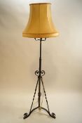 A wrought metal standard lamp, circa 1900,