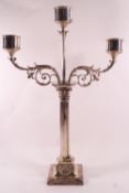 An electroplated three sconce candle unit with central support and two contrived Rococo scroll