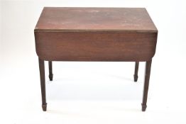 A 19th century mahogany Pembroke table on square tapering legs with spade feet,
