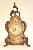 A Marti et Cie porcelain cased mantel clock, the inlaid dial with Arabic numeral and foliate swags,