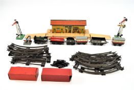 A Hornby gauge 0 model railway, some boxed, including timber wagon, sheet bar wagon, signals,