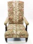 A Victorian armchair with oak turned arm supports,