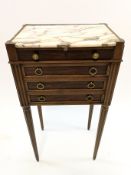 A mahogany pot cupboard with marble inset top on turned and fluted tapering legs,