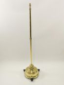 A brass standard lamp on round pierced base,