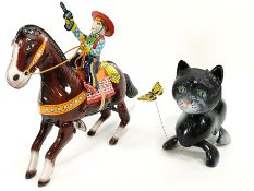 A boxed Japanese tin plate Haji clockwork toy, Western Hero, 17cm high x 21cm long,