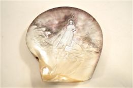 A carved shell, Saintly figure in a seascape, signed bottom right, Boulogne Ymes,