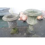 Two composite campanya style urns,