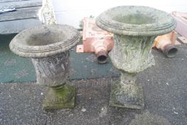 Two composite campanya style urns,