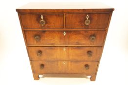 A George III chest of two short and three long drawers,