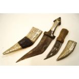 A Middle Eastern Khunfar, horn handle and white metal mount,