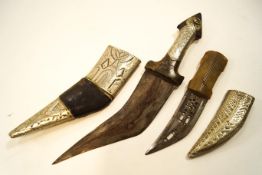 A Middle Eastern Khunfar, horn handle and white metal mount,