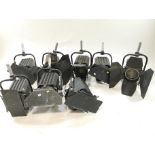 Eight lighting rig lights, mainly Polaris mod 261,