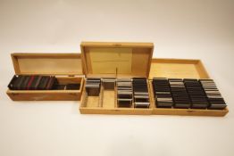 Three boxes of assorted glass slides showing local and other scenes,