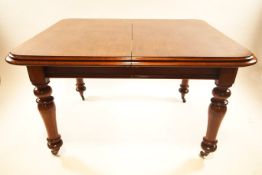 A 19th century mahogany extending dining table with leaf,