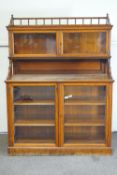 A Victorian pitch pine glazed chiffonier, the base enclosing two shelves,