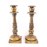 A pair of late Regency brass candlesticks, 37.