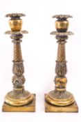 A pair of late Regency brass candlesticks, 37.