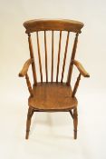 A 19th century ash stick back elbow chair,