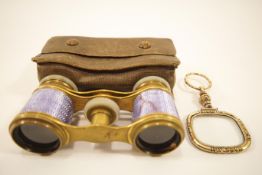 A 19th century quizzing glass together with a pair of opera glasses in case