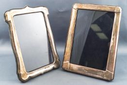 A metal fronted, wooden backed strut shaped photograph frame, stamped Birmingham 958,