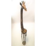 A large carved Kenyan figure of a giraffe,