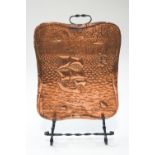 A Cornish Arts & Crafts copper and wrought steel fire screen, decorated galleon and flying fish,