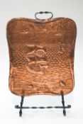 A Cornish Arts & Crafts copper and wrought steel fire screen, decorated galleon and flying fish,