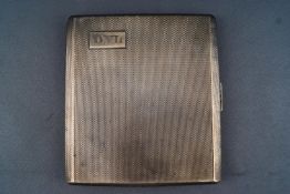 A silver cigarette case, of squared Art Deco form, the surface covered with engine turning,