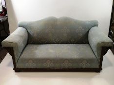 An Edwardian oak framed sofa,