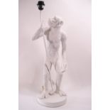 A white composite table lamp, supported by a langar monkey, 67cm high,