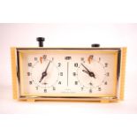 A mid 20th century cream coloured cased Russian manual wind four jewel movement Chess clock by Vega,