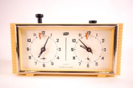 A mid 20th century cream coloured cased Russian manual wind four jewel movement Chess clock by Vega,