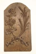 A 19th century carved hardwood panel, decorated with wheat sheaves and grapes,