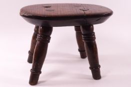 An elm stool on turned legs, 21cm high,