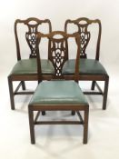 A set of three George III style mahogany chairs with pierced interlinked splats,