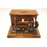 A 19th century, possibly German, hand cranked cast iron sewing machine,