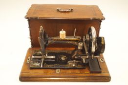 A 19th century, possibly German, hand cranked cast iron sewing machine,