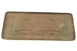 An early Newlyn rectangular copper tray, decorated with shells, circa 1900, un-marked,