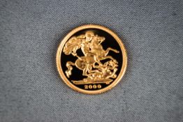 A 22ct yellow gold full Sovereign coin dated 2000.