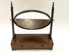 A mahogany framed swing mirror, the box base with two drawers,