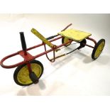 A 1950's American pull/pedal sit on buggy,