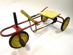 A 1950's American pull/pedal sit on buggy,