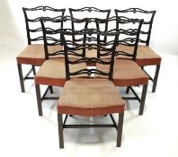 A set of eight mahogany dining chairs each with pierced ladder backs,