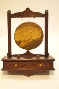 An Edwardian oak framed wall mounted dinner gong,