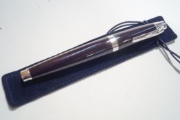 An Asprey ball point pen, in purple,